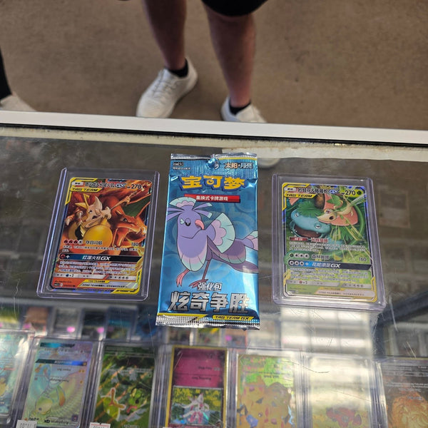 Chinese Pokémon booster packs and cards on the counter at Cards2Go