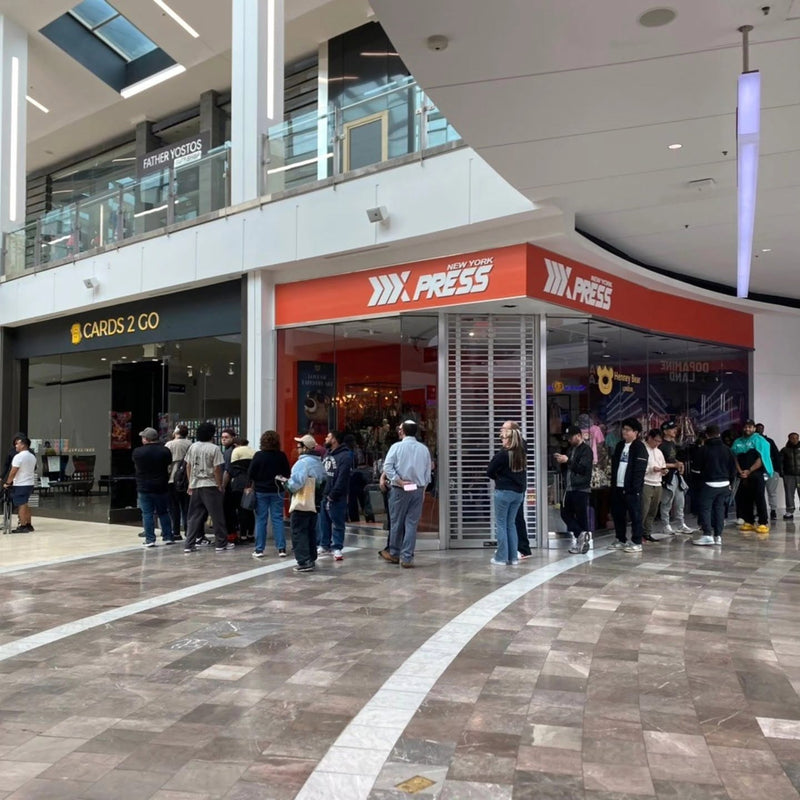Collectors lined up past neighboring stores at Cards2Go Freehold Raceway Mall in Freehold, NJ