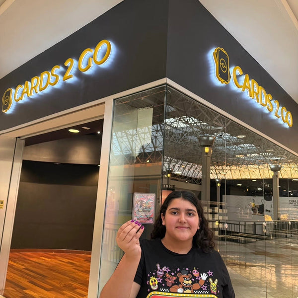 A collector showing off a big pull at Cards2Go Oxford Valley Mall in Langhorne, PA