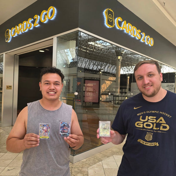A collector showing off a big pull at Cards2Go Oxford Valley Mall in Langhorne, PA